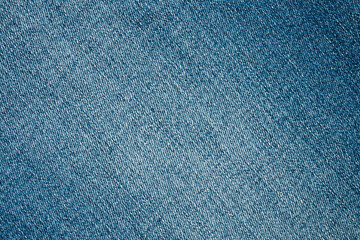 Naklejka premium Denim blue jeans texture close up background top view