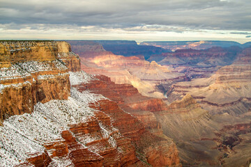 View of the Grand Canyon and the Colorado River with snow in the foreground, from the south rim, Grand Canyon National Park, Arizona.