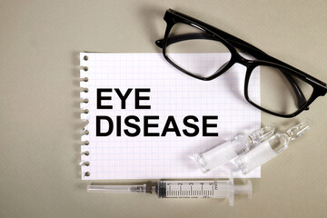 EYE DISEASE. INSCRIPTION ON WHITE PAPER. Healthcare and medical concept. Top view. copy space.