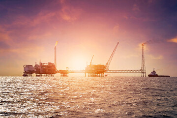 Fototapeta na wymiar Offshore construction platform for production oil and gas in gulf of Thailand with sunset sky
