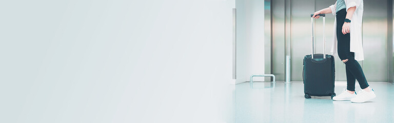 web banner solo woman journey activity with luggage concept from hipster woman wait elevator for check in to hotel © tickcharoen04