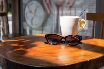A mug and glasses on the table