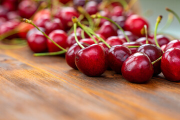 Selective focus image. A lot of fresh sweet cherry fruit berries