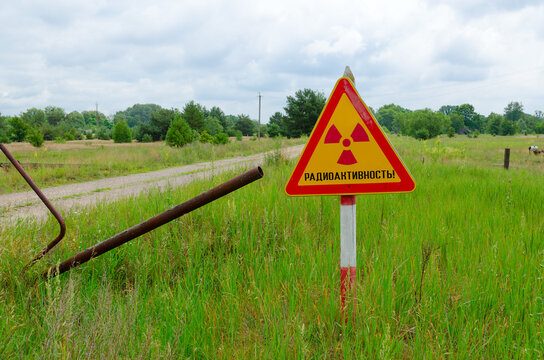 Warning sign Radioactivity at entrance to resettled village of Pogonnoye in Chernobyl exclusion zone, Belarus