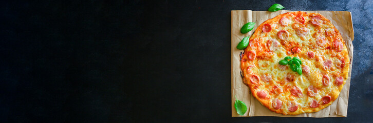 pizza salami sausages cheese classic recipe sauce fast food Takeaway serving size. food background top view copy space 