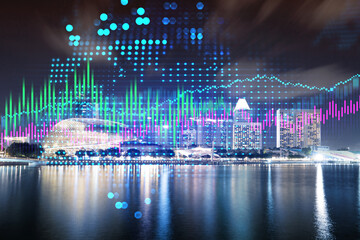 Stock market graph hologram, night panorama city view of Singapore, popular location to gain financial education in Asia. The concept of international research. Double exposure.