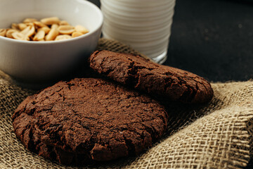 Chocolate cookies on dark table close up