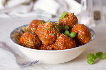 Meatballs with tomato sauce and cheese. horizontal photo