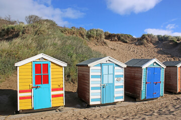 Fototapeta na wymiar Beach huts at Saunton Sands beach, Devon