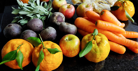 A small variety of fruits and vegetables that have just arrived from the organic fair.