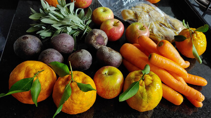A small variety of fruits and vegetables that have just arrived from the organic fair.