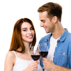Smiling happy couple drinking red wine. Portrait image of caucasian models with redwine glasses in love studio concept, isolated over white background. Man and woman posing together. Square picture.