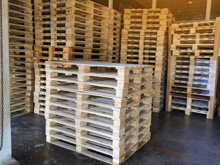 Wooden pallets stack at the freight cargo warehouse for transportation and logistics industrial 