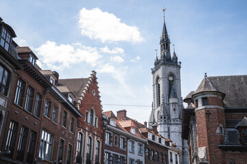 Fototapeta na wymiar Perspective of Urban City of Tournai with Apartments and Church Tower