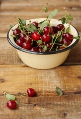 Ripe red cherries in a bowl macro