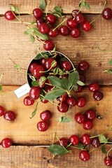 Ripe red cherries in an iron cup