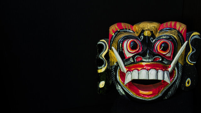 Tribal mask of a mythological character called Barong from the island of  Bali. made of wood on black background .Indonesia Stock Photo | Adobe Stock