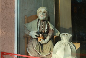 granny doll with coffee grinder