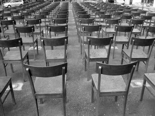 Rows of chairs at a Holocaust memorial in Leipzig, Germany. The chairs cover the foundation of the...