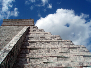 Fototapeta na wymiar Close-up of the staircase and steps on one side of a Mayan pyramid at the Chichen Itza historical site in Mexico. 