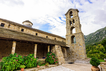Fototapeta na wymiar Holy Virgin Paraskevi Church (Ι.Ν.ΑΓΙΑΣ ΠΑΡΑΣΚΕΥΗΣ) in the village of Rodavgi, Greece. Very old church made entirely of stone