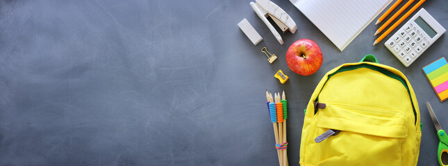 education. Back to school concept over blackboard background. top view, flat lay