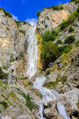 Fototapeta na wymiar Waterfalls of Tzoumerka. One of two picturesque waterfalls in the mountains of a national park in eastern Tzoumerka, in the vicinity of the village of Kriopigi. Greece