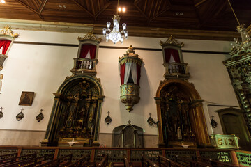 
ancient church wide-angle view inside with local saints of faith and christian worship golden green and red details