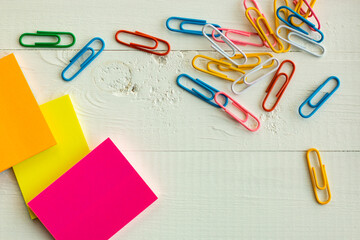 colorful paper clips and stationery on the white background, colorful life