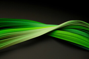 Green color strip wave paper. Abstract texture black horizontal background.