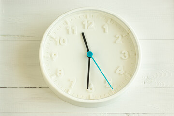  white clock on the white wall, work time