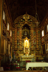 Fototapeta na wymiar ancient church wide-angle view inside with local saints of faith and christian worship golden green and red details