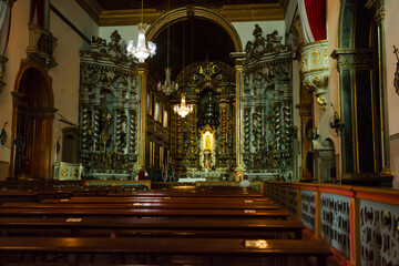Fototapeta na wymiar ancient church wide-angle view inside with local saints of faith and christian worship golden green and red details