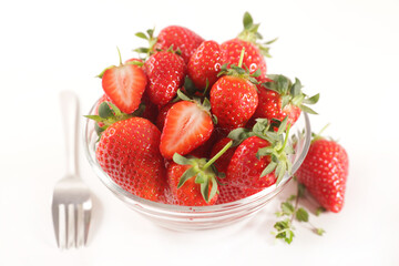 bowl of fresh strawberries on white background