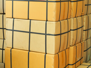 Pile of big cardboard boxes in a store warehouse.