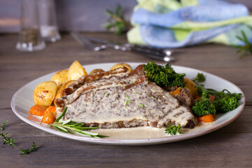 Beef steak fillets with creamy Gorgonzola cheese dressing