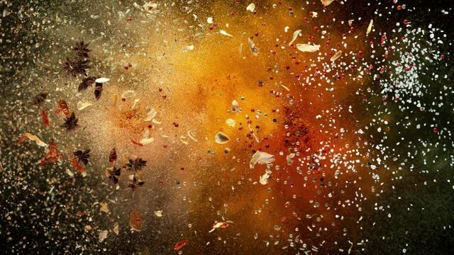 Super Slow Motion Shot of Colorful Seasoning Explosion on Black Background at 1000fps.