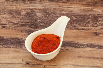 Dry paprika powder in the bowl