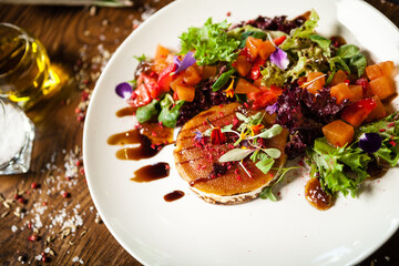 Black Angus hand-made dumplings. Cucumber-julienne with chilli-garlic butter or beef stock with sour cream. Delicious meat food closeup served on a table for lunch in modern cuisine gourmet restaurant