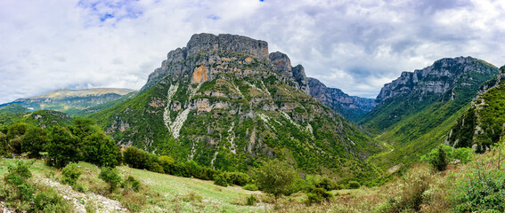 Wide panoramic view of Vikos Gorge from View Point near Vikos Village. The Vikos Gorge is listed by the Guinness Book of Records as the deepest canyon in the world.