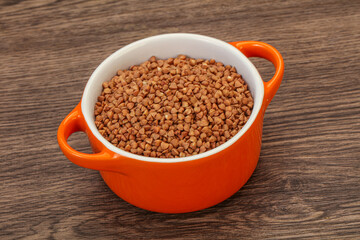 Raw buсkwheat cereal in the bowl