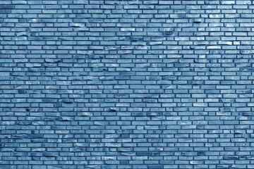 Fototapeta na wymiar The background of the old blue brick wall for design interior and various scenes or as a background for video interviews.