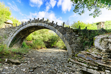 Fototapeta na wymiar Bridge Captain Bear. Small, typical for the Zagori region, arched, stone bridge, built in the 19th century