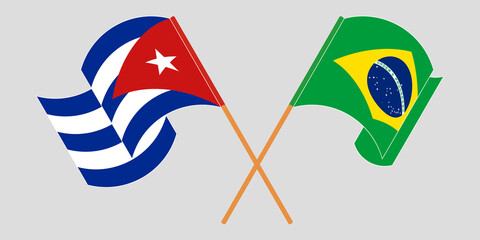 Crossed and waving flags of Cuba and Brazil