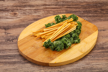 Chechel cheese sticks over board
