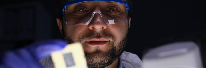 Worker holding microchip