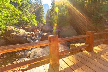 Vernal Falls bridge of Merced River with rainbow on John Muir trail in Yosemite National Park. Summer travel in California, United States.