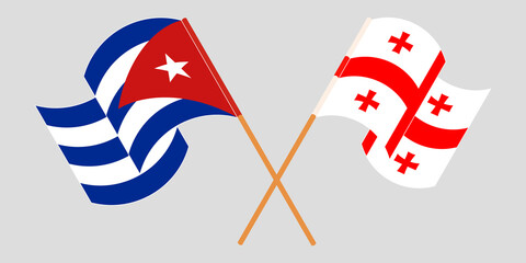 Crossed and waving flags of Cuba and Georgia