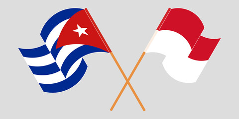 Crossed and waving flags of Cuba and Indonesia