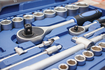 Fototapeta na wymiar Close-up wrenches in a tool case. Chrome plated wrenches. Wrenches of different sizes and types.